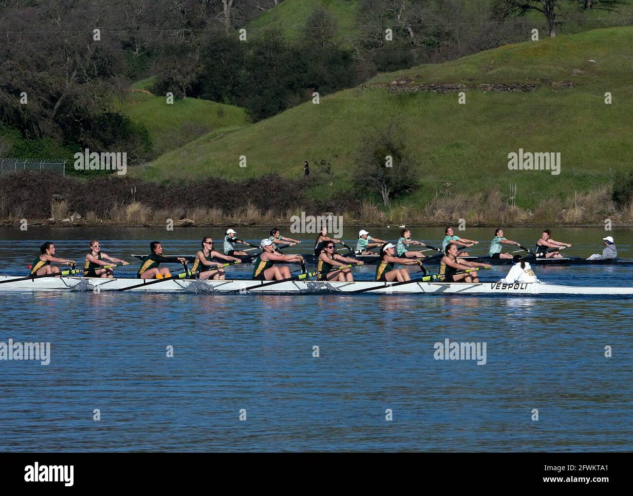 Close race between competitors in women's eight rowing teams. Lake Natoma, California Stock Photo