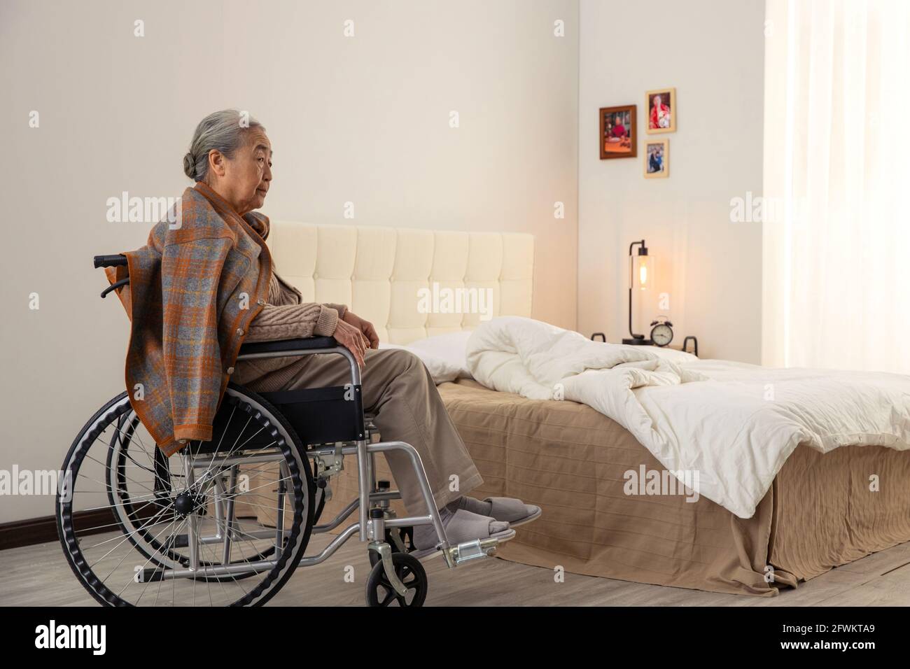 Old man in a wheelchair hi-res stock photography and images - Alamy