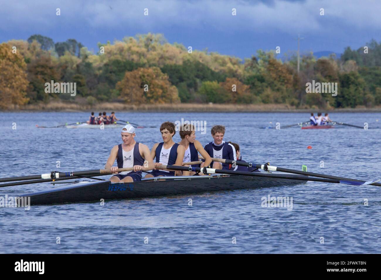 High School Coxed Quad Rowing Team Relaxing After the Race in Northern California Stock Photo