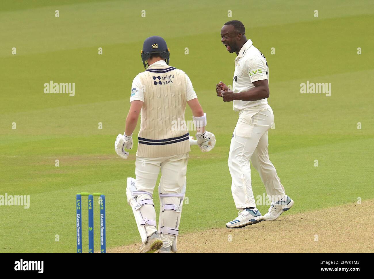 London, UK. 23 May, 2021. London, UK. Surrey’s Kemar Roach celebrates after getting the wicket of Middlesex’s Jack Davies as Surrey take on Middlesex in  the County Championship at the Kia Oval, day four. David Rowe/Alamy Live News Stock Photo