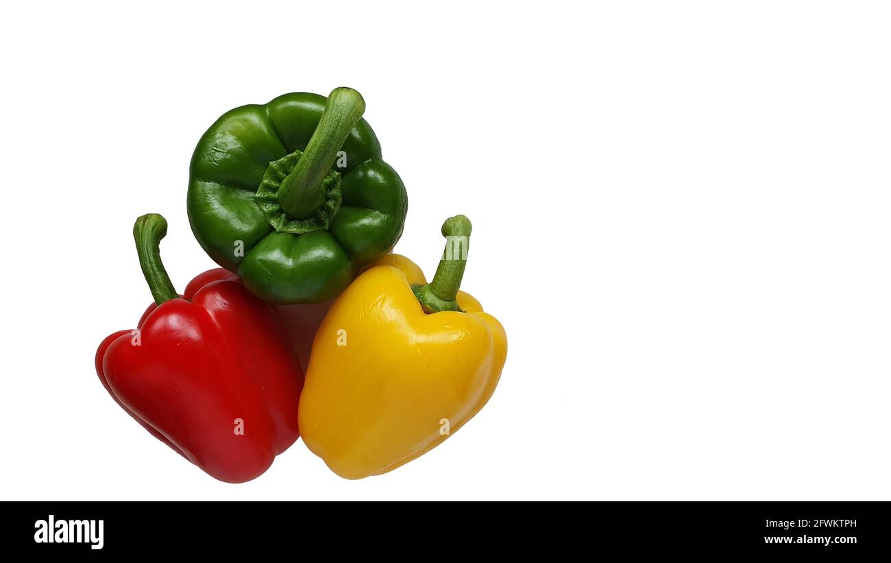 Red, white and green peppers on white background Stock Photo - Alamy