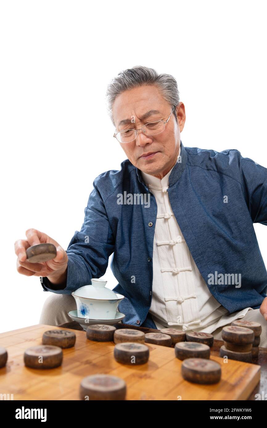 Old man playing chess Stock Photo