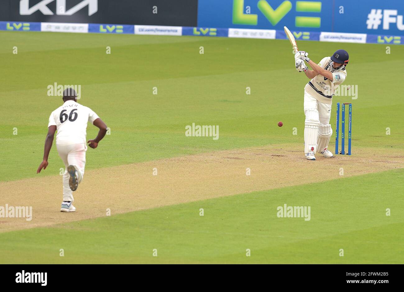 London, UK. 23 May, 2021. London, UK. Surrey’s Kemar Roach bowls Middlesex’s John Simpson as Surrey take on Middlesex in  the County Championship at the Kia Oval, day four. David Rowe/Alamy Live News Stock Photo