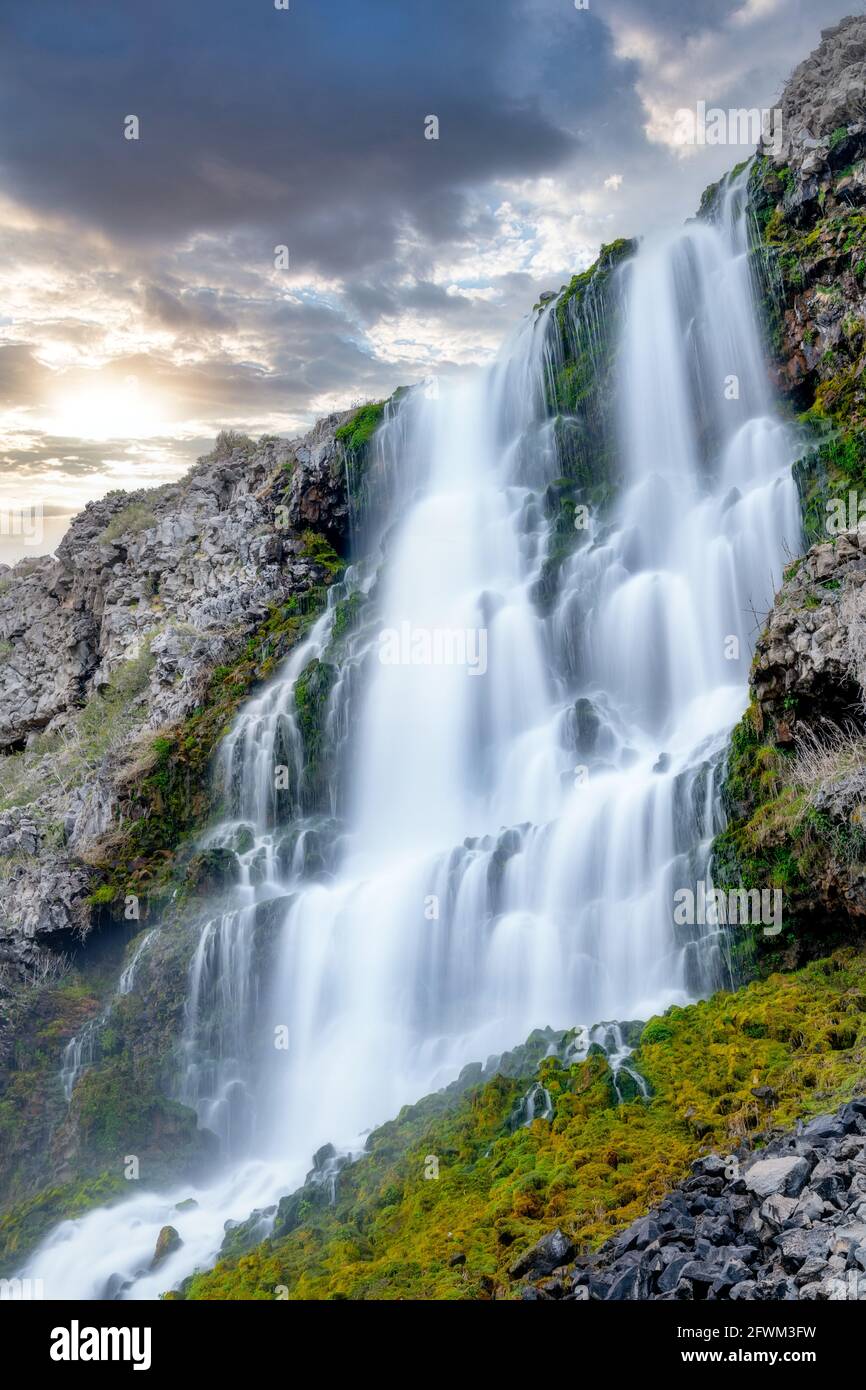 Beautiful waterfall in Idaho with clouds in the sky Stock Photo