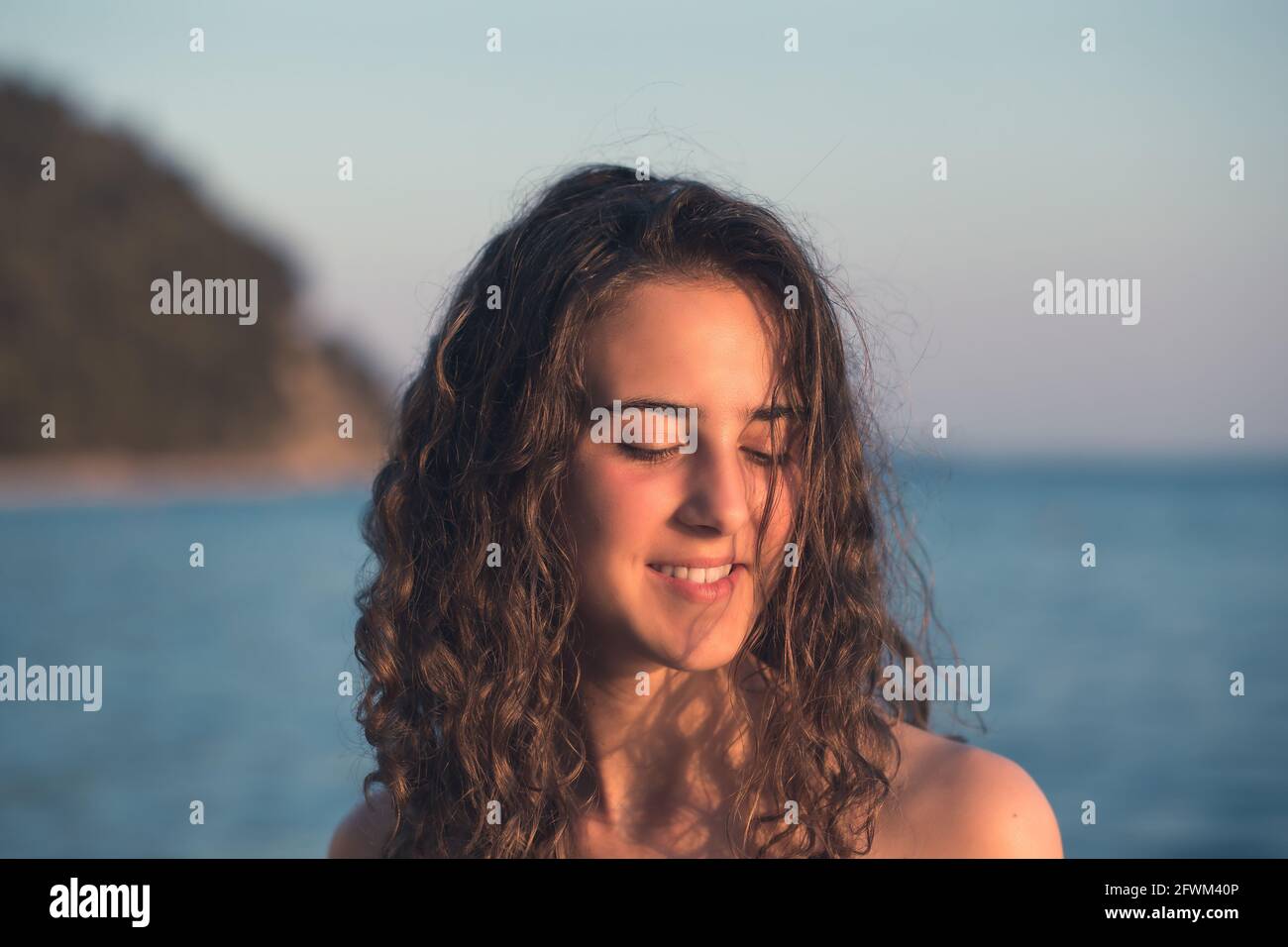 Female curly brunette hair hi-res stock photography and images - Alamy