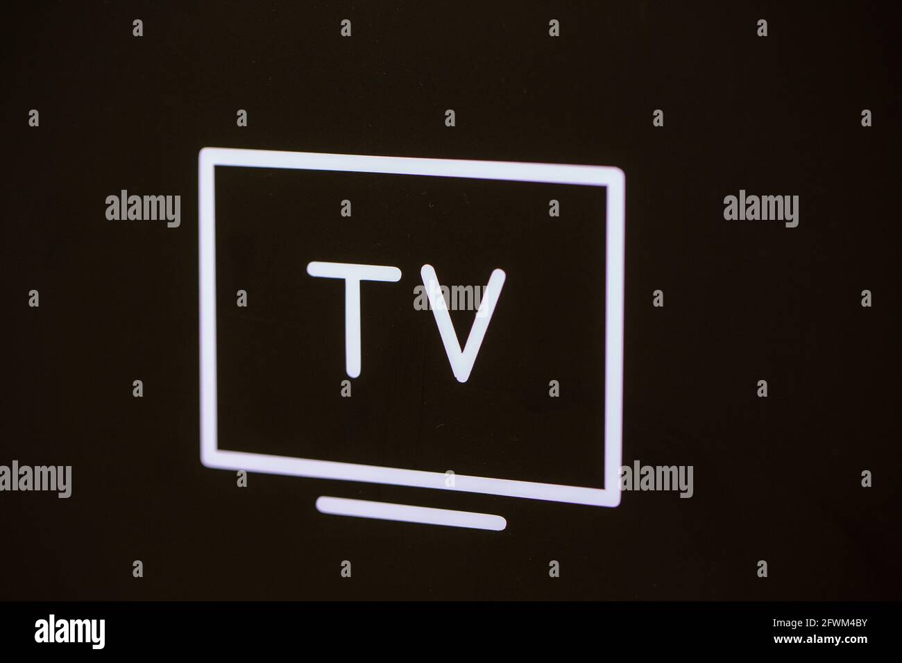 A white TV icon in the black background Stock Photo - Alamy