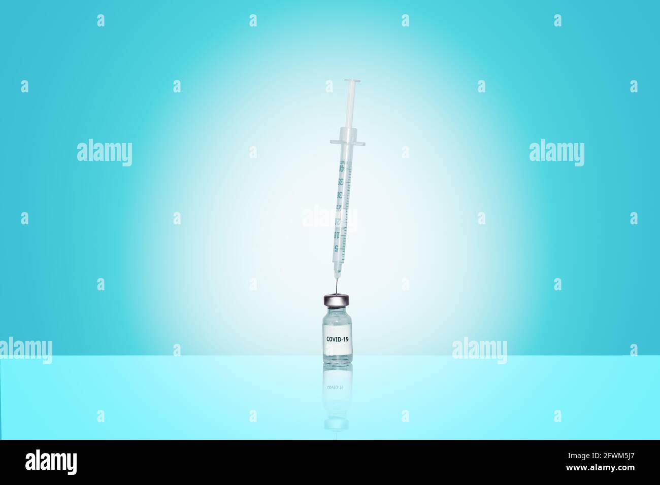 Syringe in an ampoule with Corona virus vaccine Stock Photo
