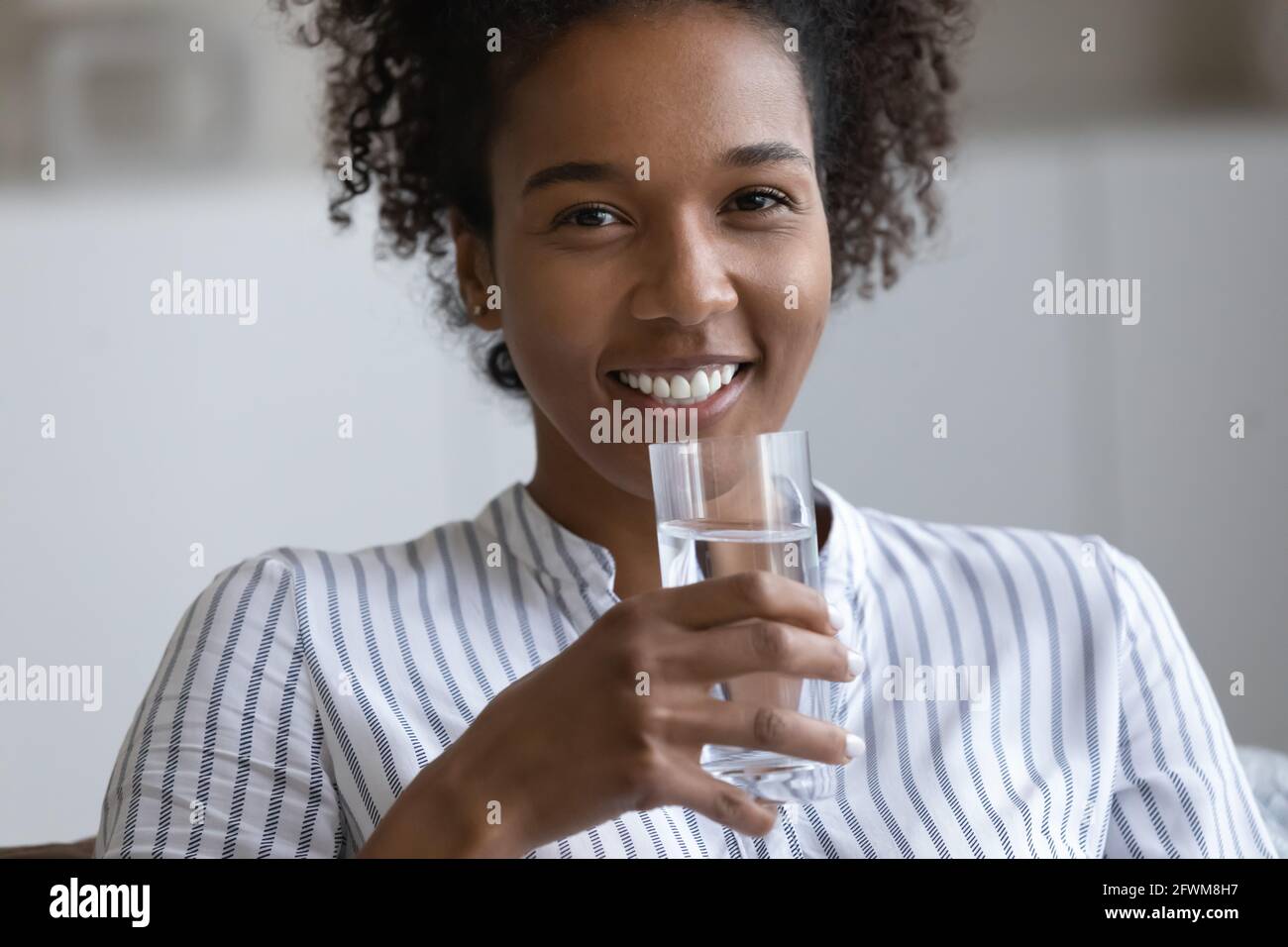 Happy African Woman Holding Glass Of Fresh Pure Water Stock Photo Alamy