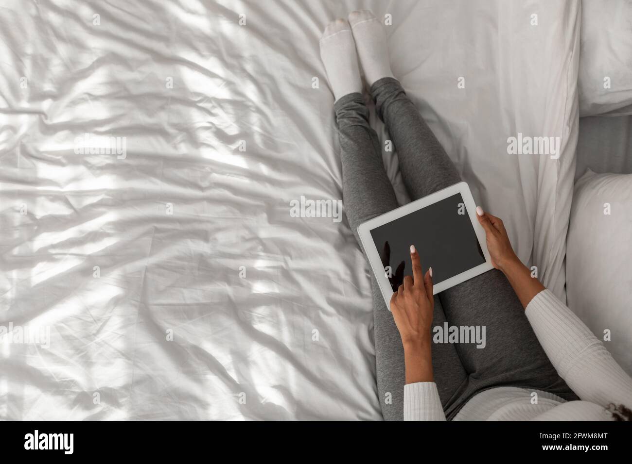 African American female holding tablet with blank screen Stock Photo ...