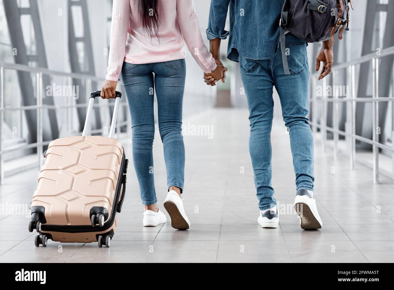 Ready For Vacation. Black Couple Holding Hands While Walking In Airport ...