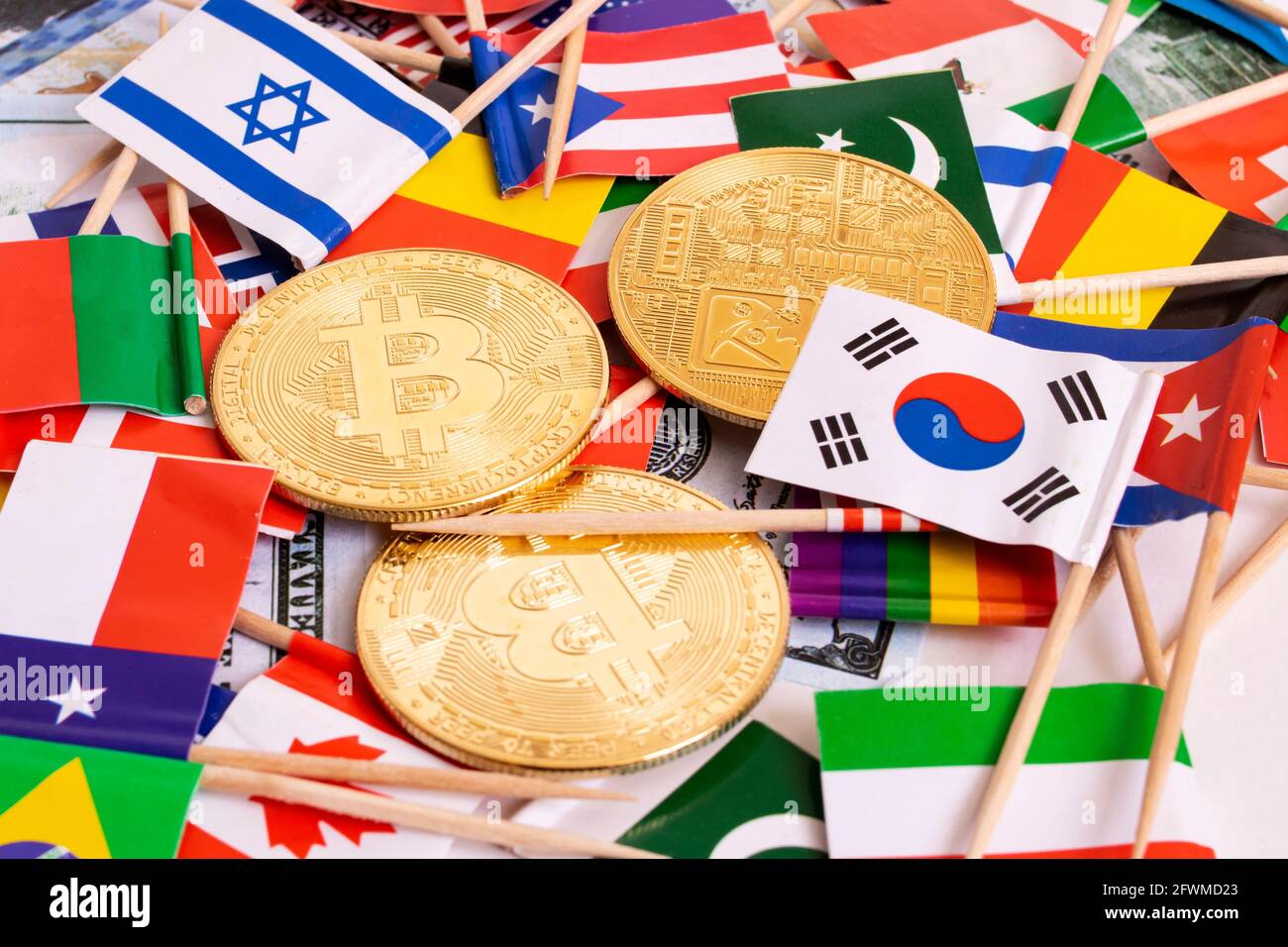 Bitcoins coin on the background of flags of different countries close up  Stock Photo - Alamy