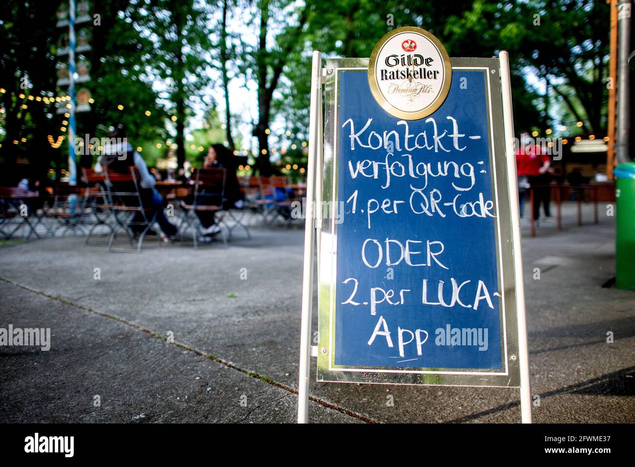 Hanover, Germany. 23rd May, 2021. A sign reading 'Contact tracing: 1. via QR code or 2. via Luca app' stands in the entrance area of a beer garden in the city centre. Credit: Hauke-Christian Dittrich/dpa/Alamy Live News Stock Photo