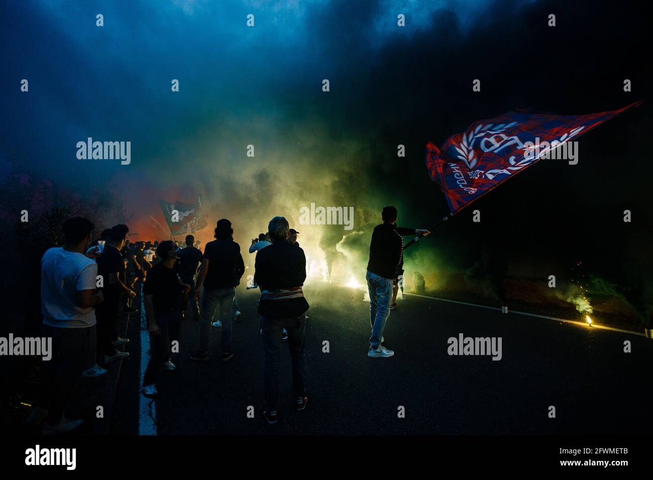 Bologna, Italy. 23rd May, 2021. Bologna FC fans greet the team with flares, scarves and flags prior to the Serie A last match on 2020-21 season from the hill behind of Renato Dall'Ara Stadium. Credit: Massimiliano Donati/Alamy Live News Stock Photo