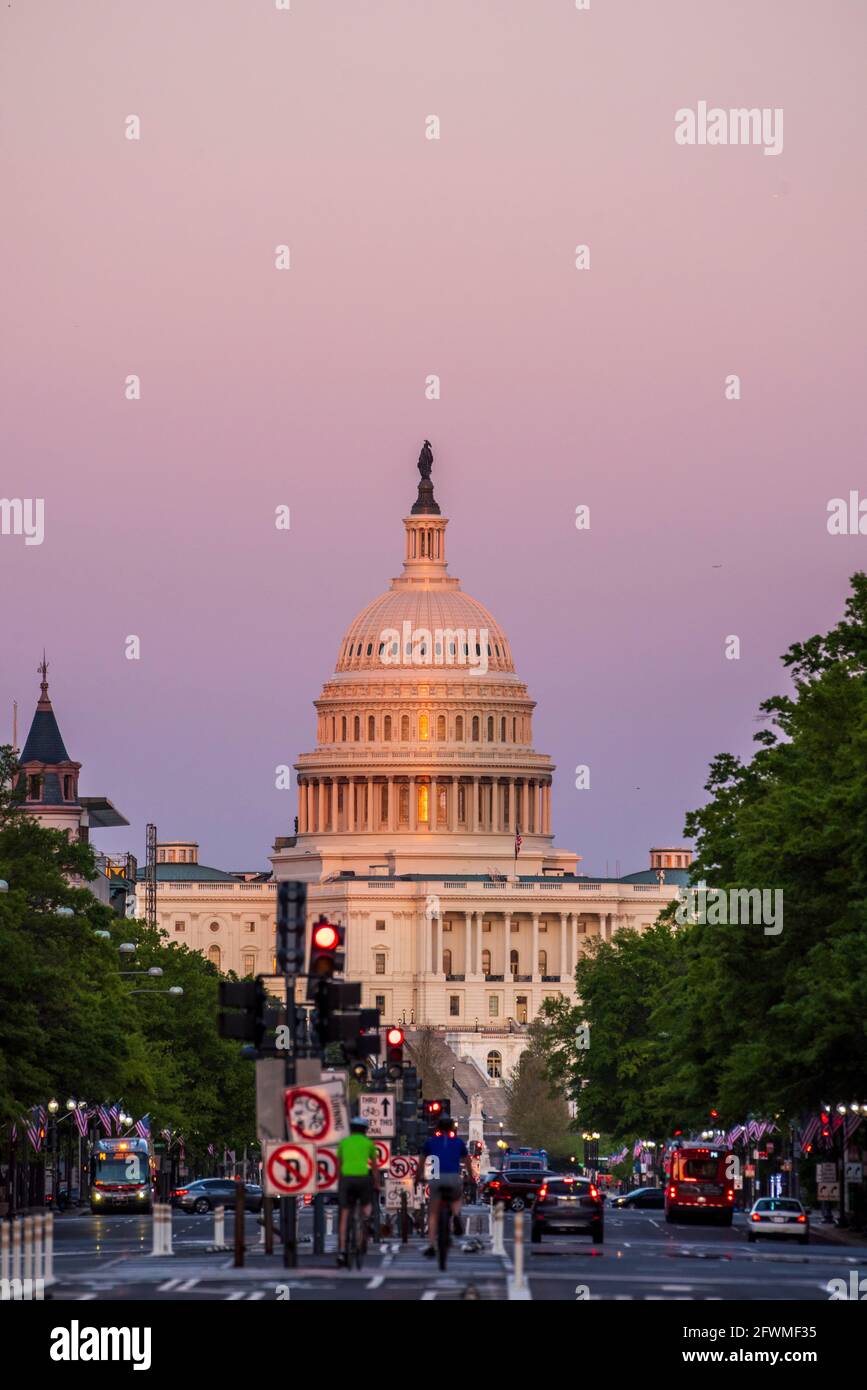The last rays of the day shine on the United States Capitol Building in Washington, D.C., viewed from Pennsylvania Avenue. Stock Photo