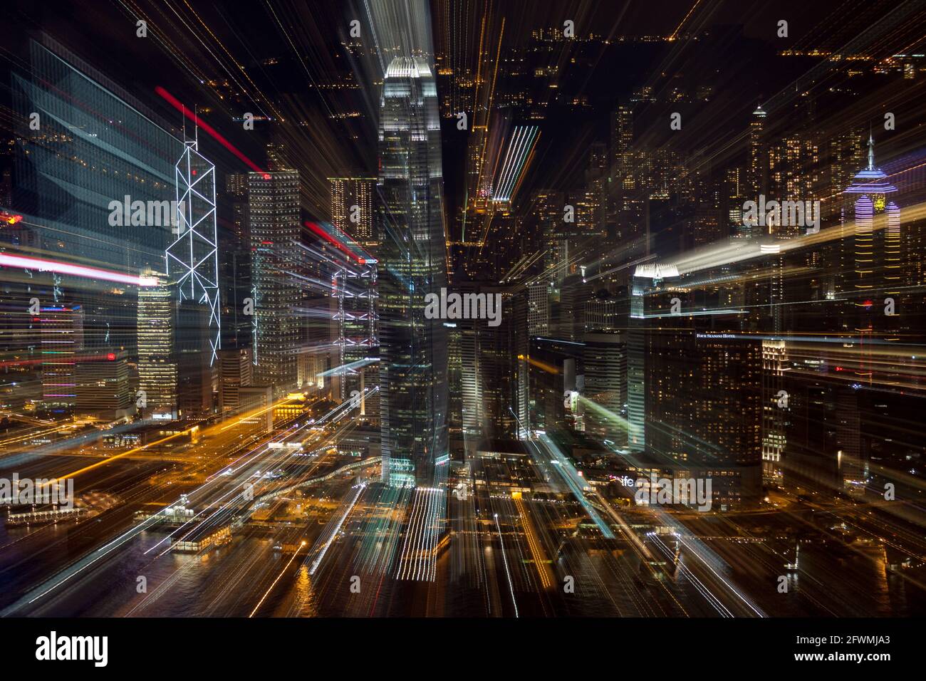 A dynamic motion-zoomed view of the Hong Kong Island harbourfront at night Stock Photo