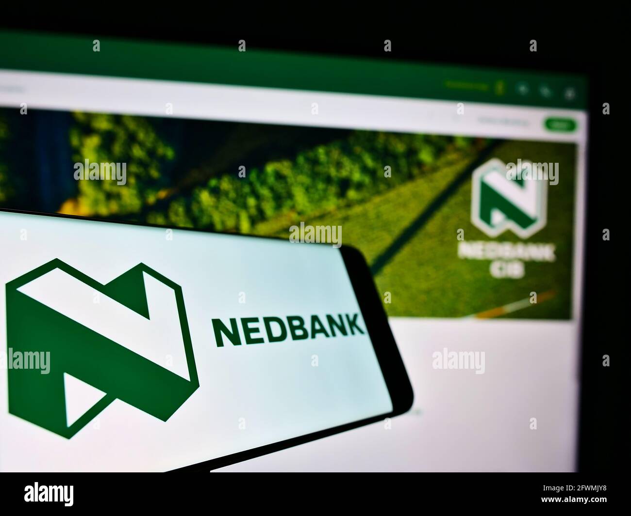 Mobile Phone With Business Logo Of South African Bank Nedbank Group Limited On Screen In Front Of Website Focus On Center Left Of Phone Display Stock Photo Alamy