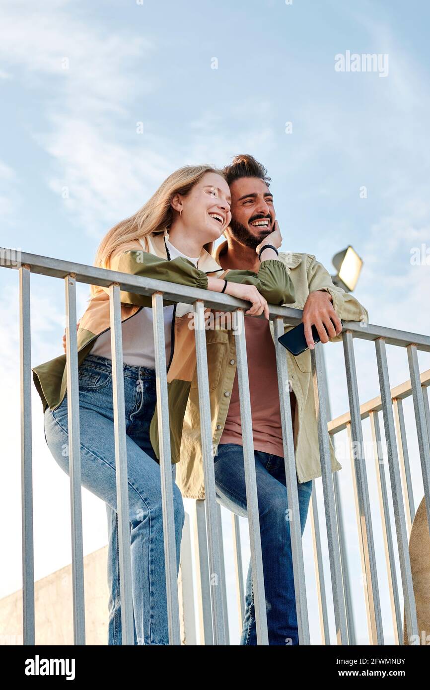 Young multiracial couple smiling and having a good time Stock Photo