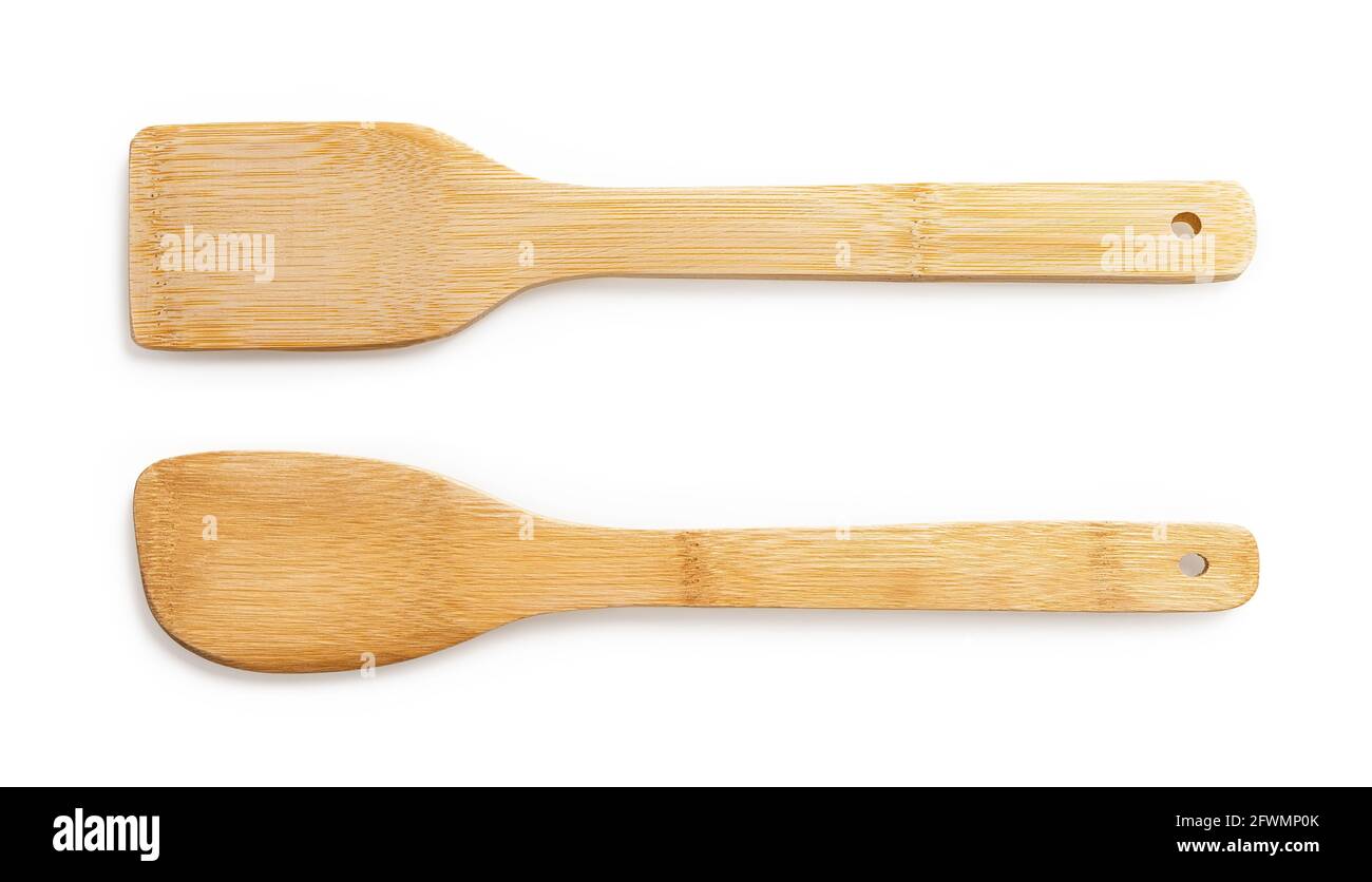 Two wooden spatulas for cooking isolated on white background. Bamboo kitchen utensils for zero waste and green living lifestyle. Rustic kitchenware. Stock Photo