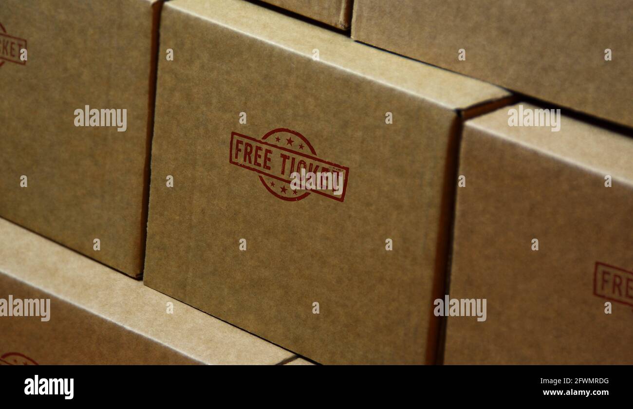 Free ticket stamp printed on cardboard box. Admission and free entry concept. Stock Photo