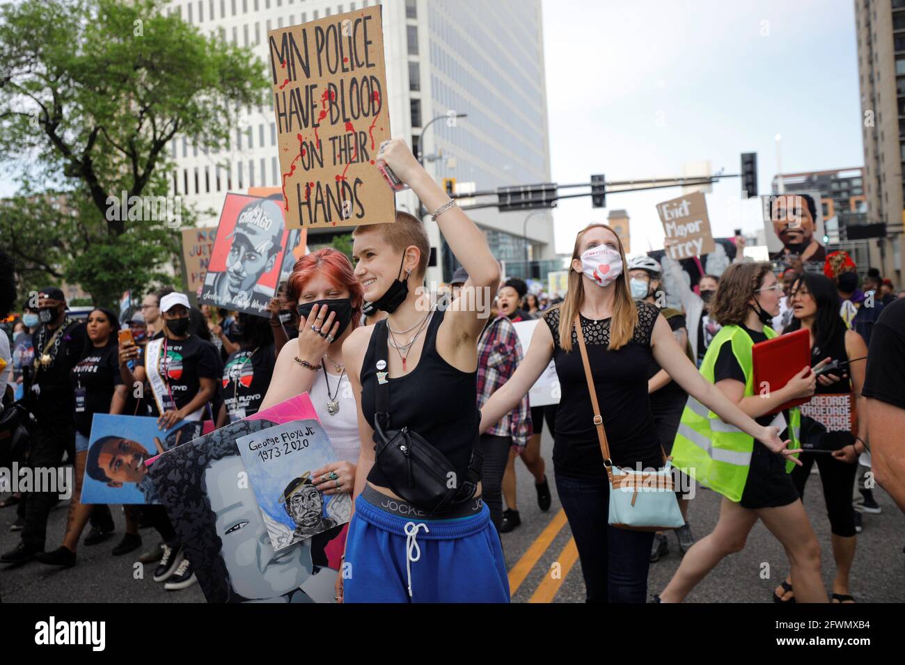 People march during the 'One Year, What's Changed?' rally hosted by the George Floyd Memorial Foundation  to commemorate the first anniversary of his death, in Minneapolis, Minnesota, U.S. May 23, 2021. REUTERS/Nicholas Pfosi  REFILE - CORRECTING NAME OF THE ORGANIZATION Stock Photo
