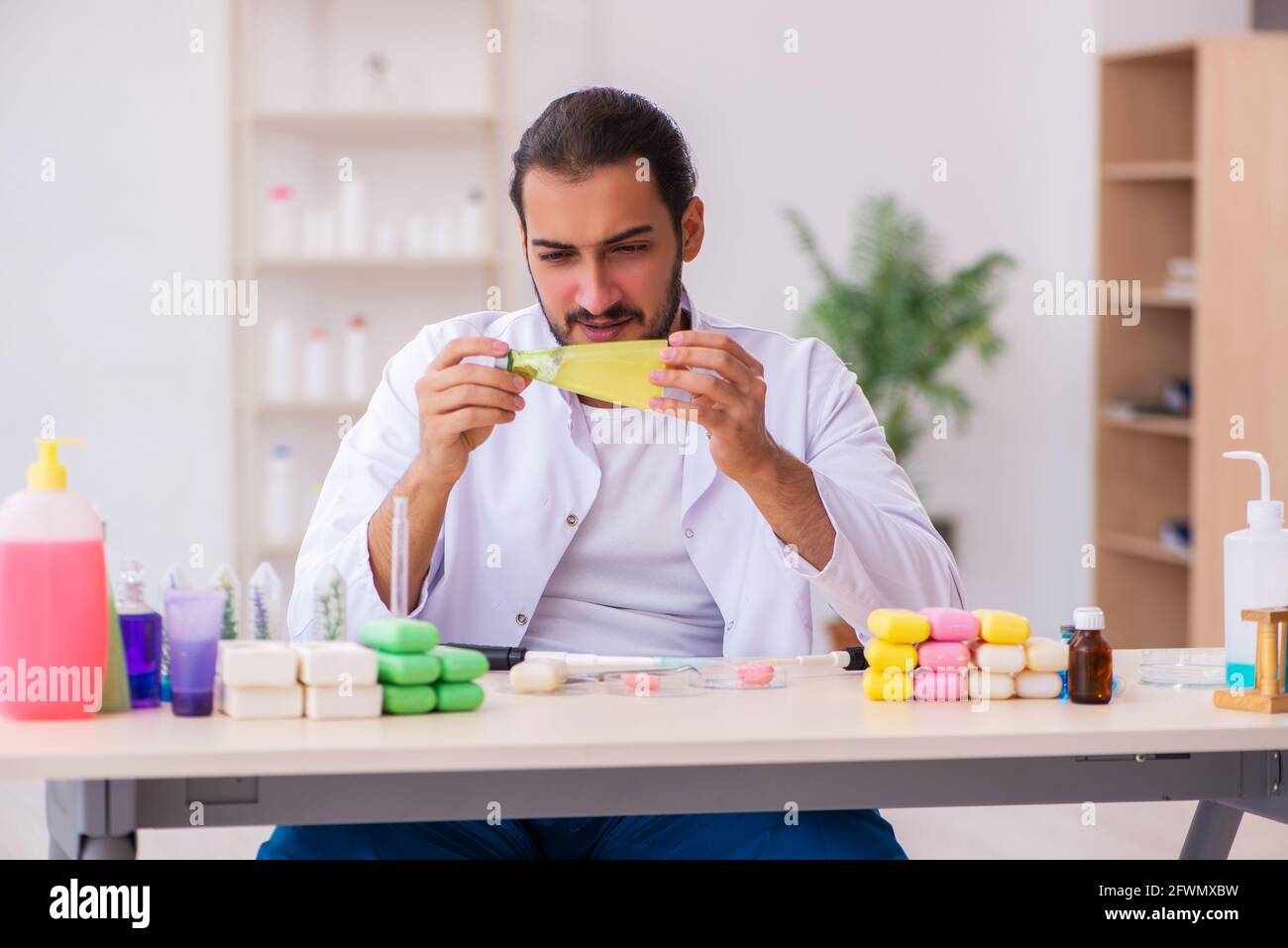 Young chemist testing soap in the lab Stock Photo - Alamy