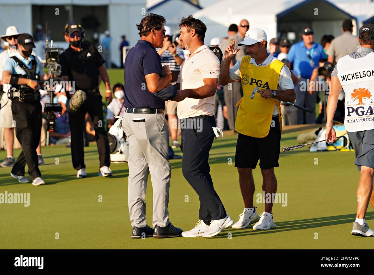 Kiawah Island, United States. 23rd May, 2021. Phil Mickelson thanks Brooks Koepka after winning the 103rd PGA Championship at Kiawah Island Golf Resort Ocean Course on Kiawah Island, South Carolina on Sunday, May 23, 2021. Photo by Richard Ellis/UPI Credit: UPI/Alamy Live News Stock Photo