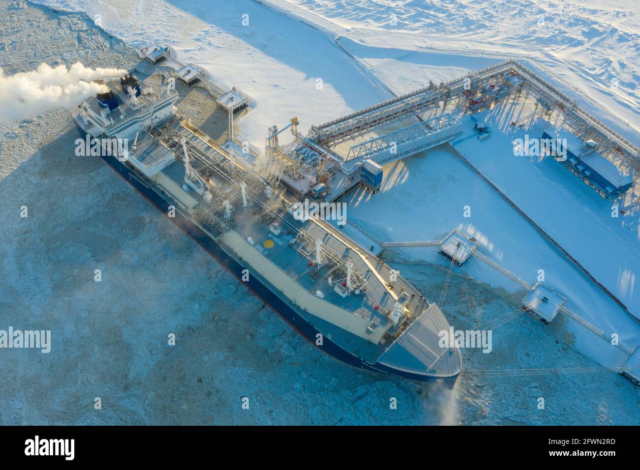 Sabetta, Tyumen region, Russia - March 30, 2021: The Vladimir Vize gas carrier is loaded with liquefied natural gas at the berth. Stock Photo