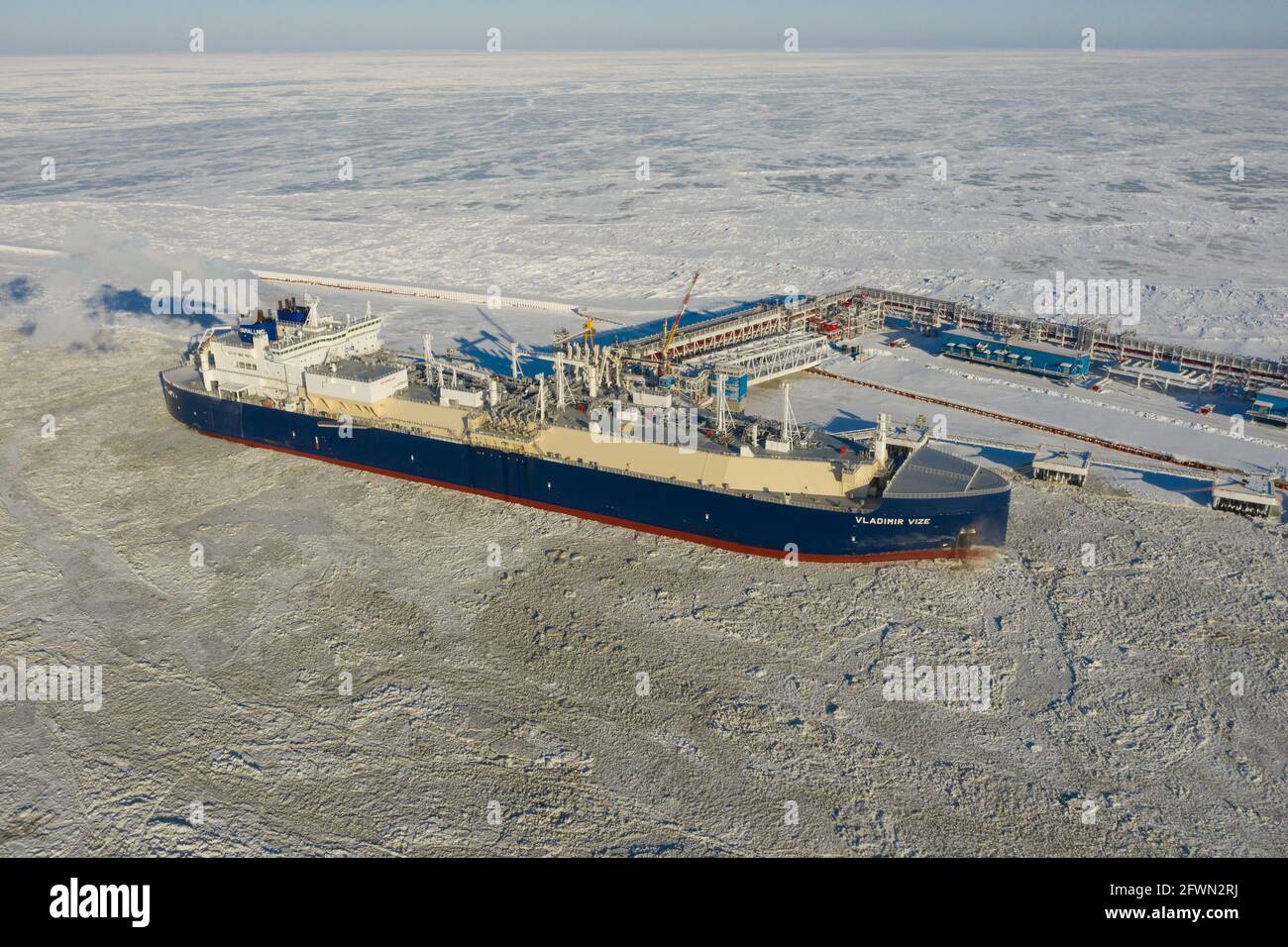 Sabetta, Tyumen region, Russia - March 30, 2021: The Vladimir Vize gas carrier is loaded with liquefied natural gas at the berth. Stock Photo