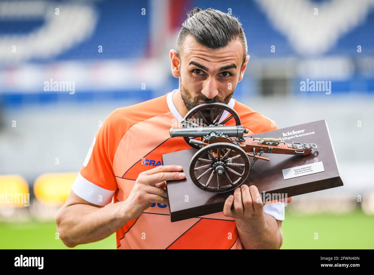 Kiel, Germany. 23rd 2021. Serdar Dursun of Darmstadt is awarded the trophy of top scorer in the 2. Bundesliga after German Bundesliga match between Holstein and SV Darmstadt