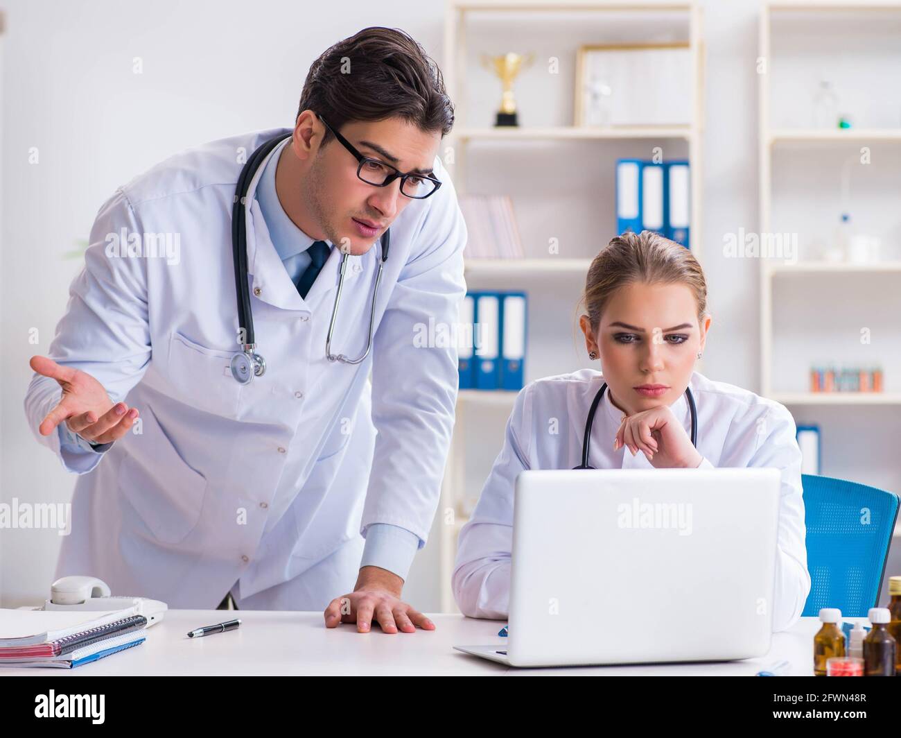 The male and female doctor having discussion in hospital Stock Photo ...
