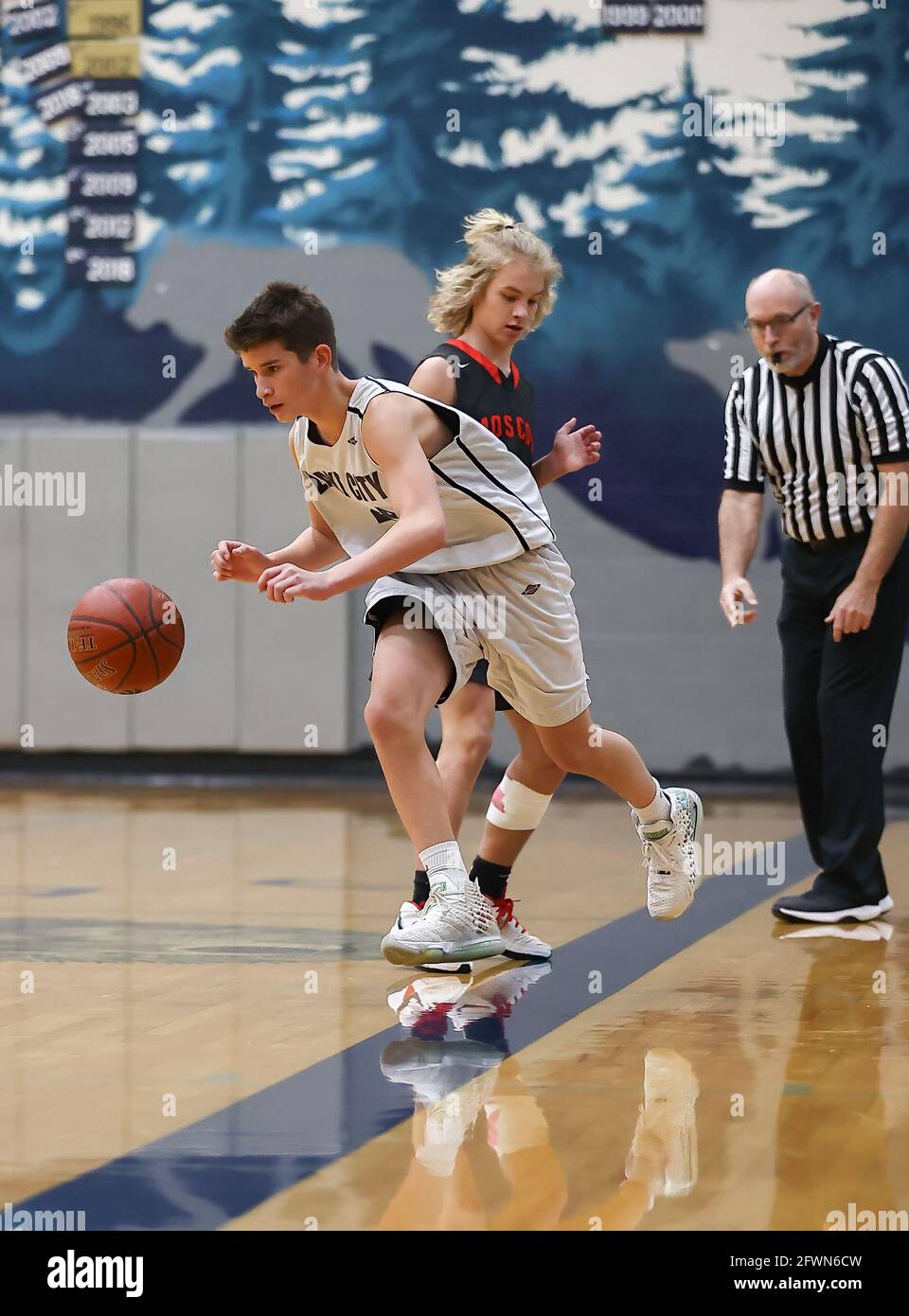 Freshmen basketball action with Moscow vs Lake City High School in Coeur d'Alene, Idaho. Stock Photo