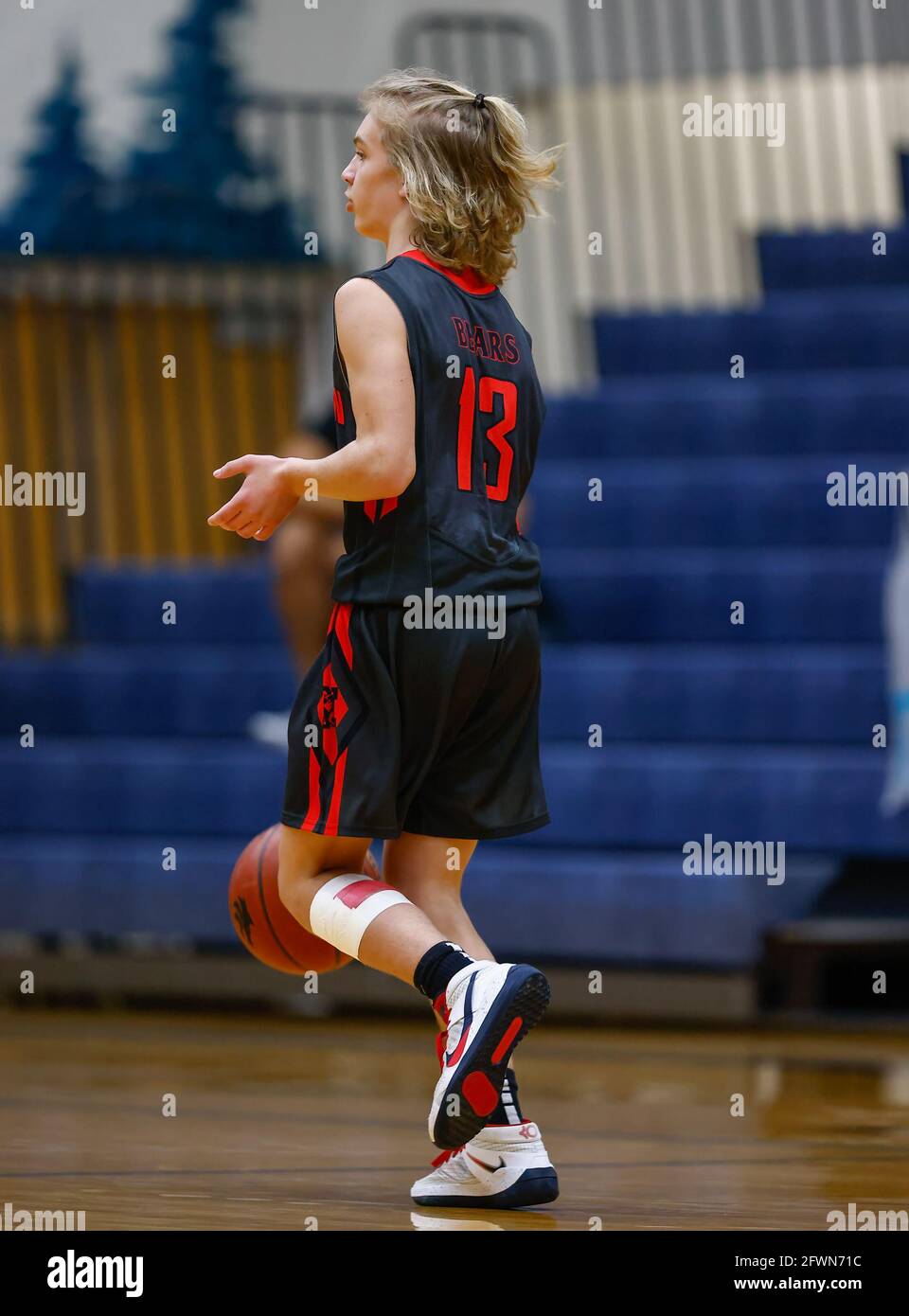 Freshmen basketball action with Moscow vs Lake City High School in Coeur d'Alene, Idaho. Stock Photo