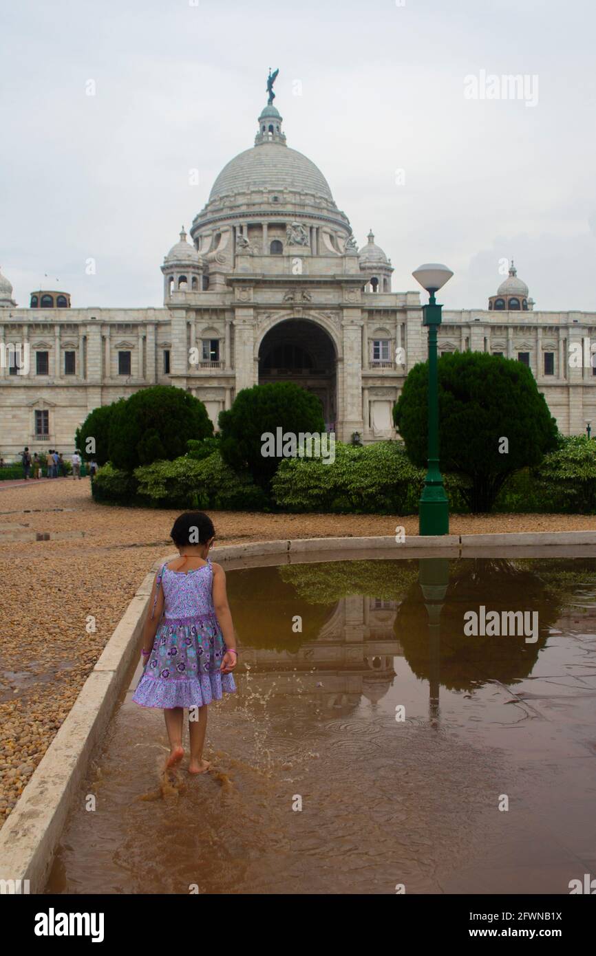 Kolkata, India. Child walks in front of the Victoria Memorial Stock Photo