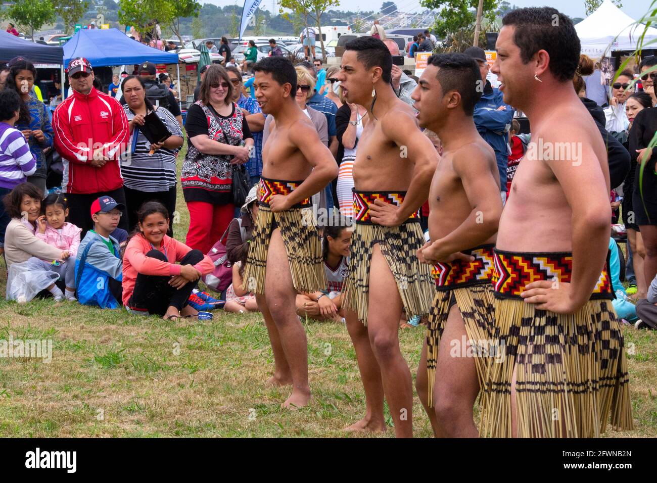 Auckland, New Zealand. Crowd watches Maori haka at Waitangi Day celebrations Stock Photo