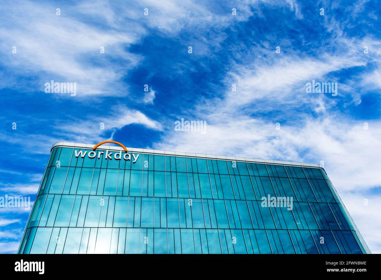 Workday headquarters building facade under beautiful sky. Workday, Inc. is on demand financial management and human capital management software vendor Stock Photo