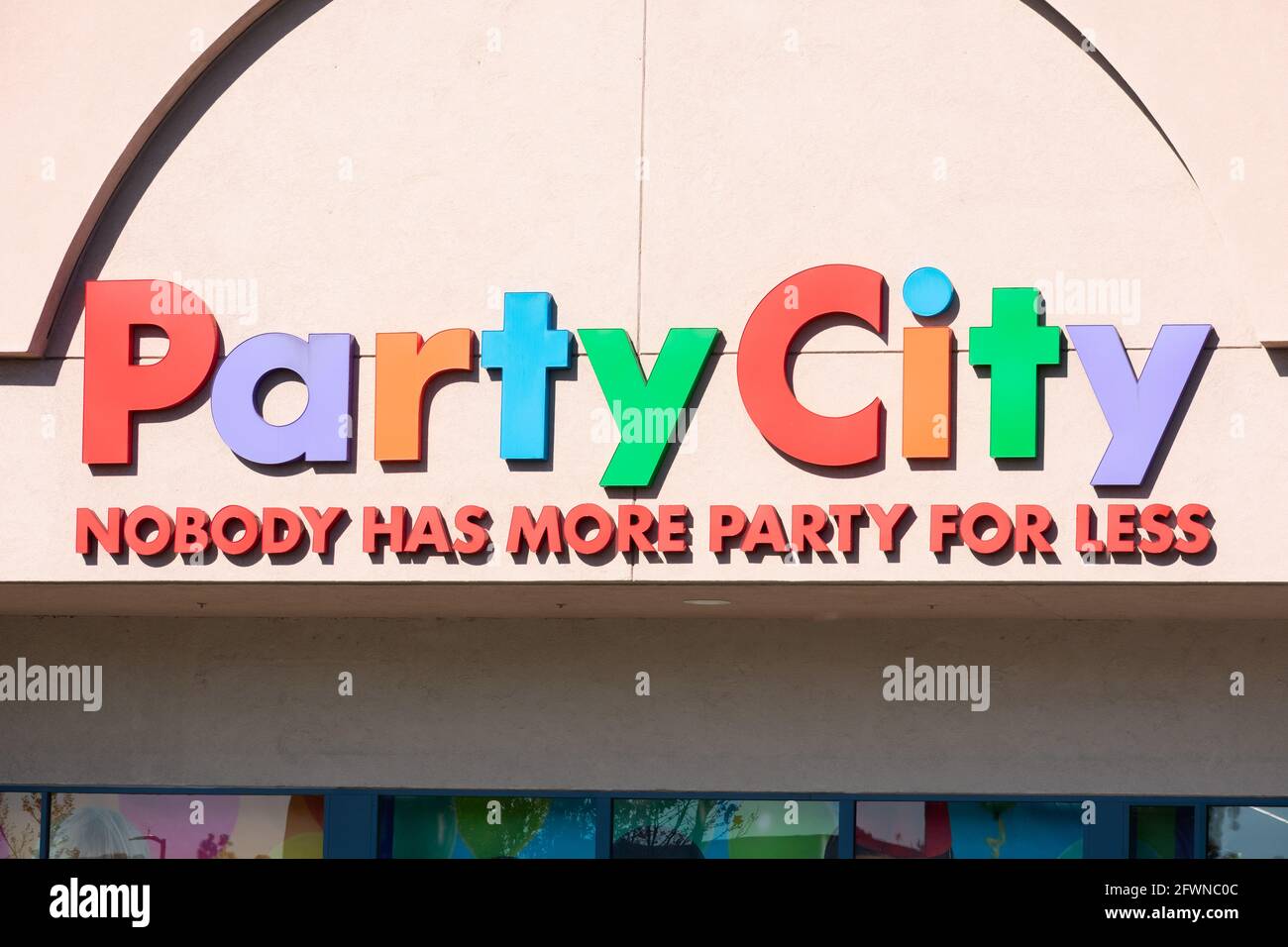 Party City retail chain store exterior. Nobody has more party for less slogan of facade. - Pleasanton, California, USA - 2020 Stock Photo