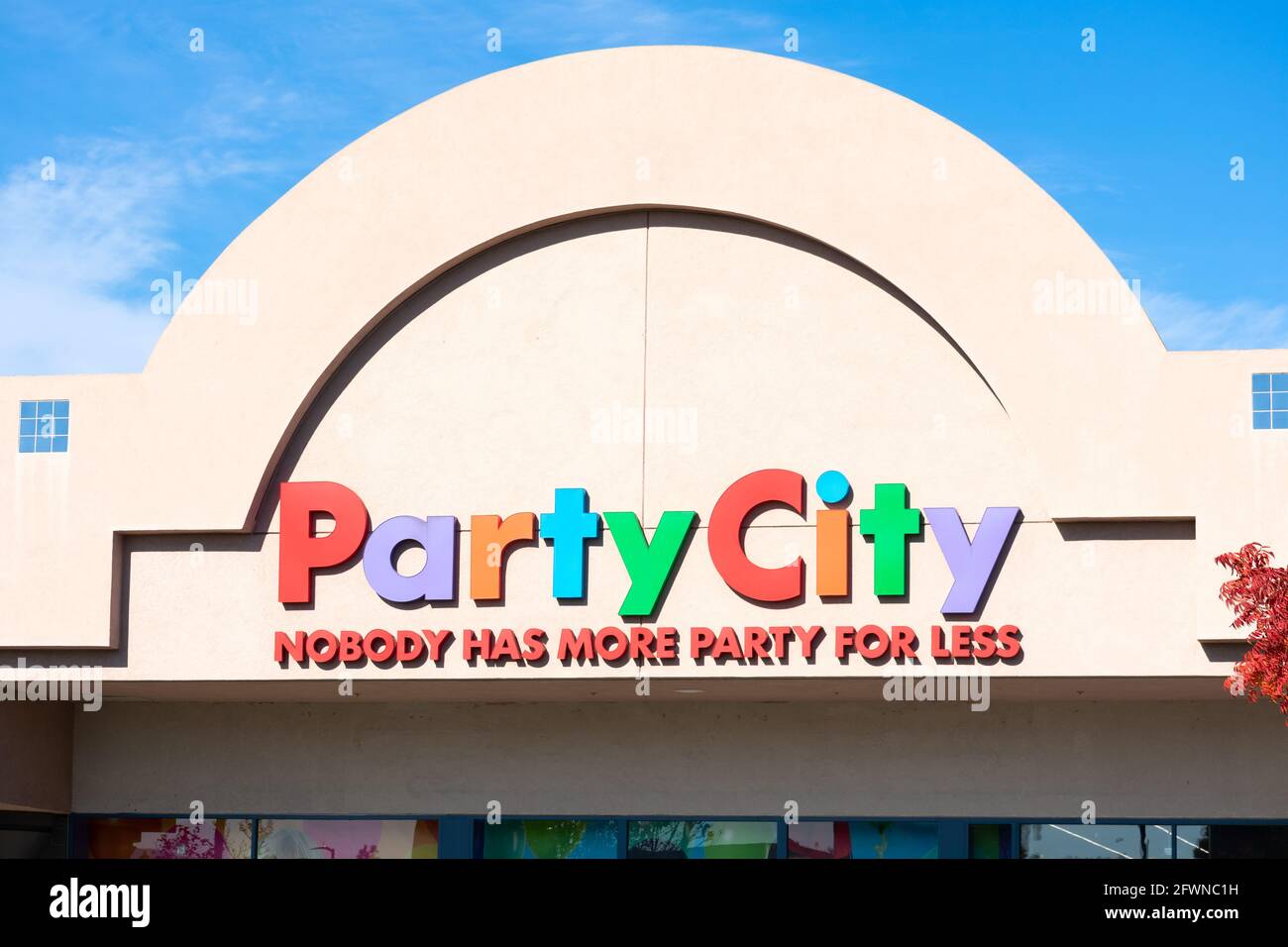 Party City retail chain store exterior. Nobody has more party for less slogan of facade. - Pleasanton, California, USA - 2020 Stock Photo