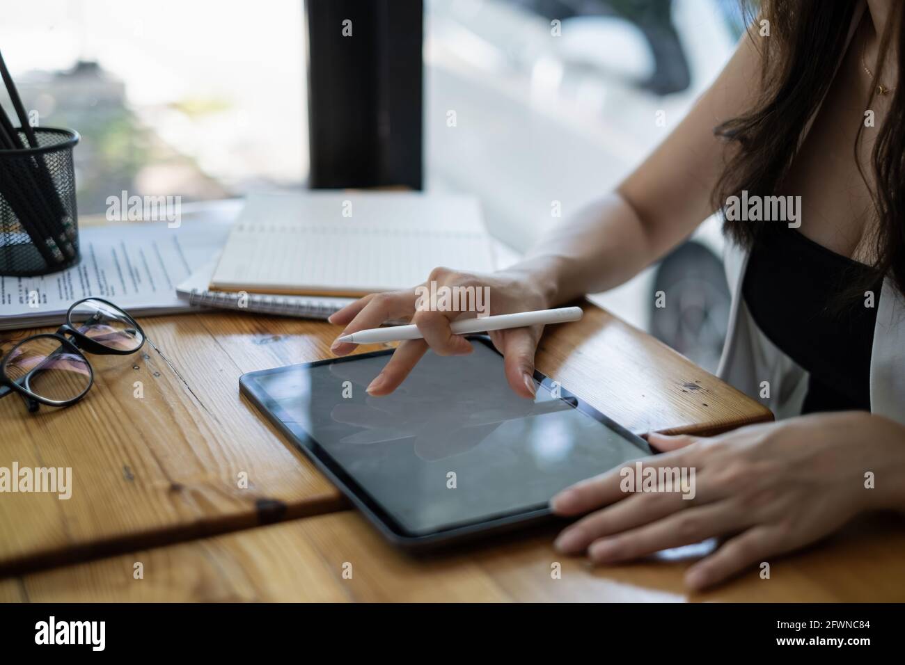 User experience concept. Creative Web Designer sketching application and developing template layout on laptop, framework for digital devices. Stock Photo