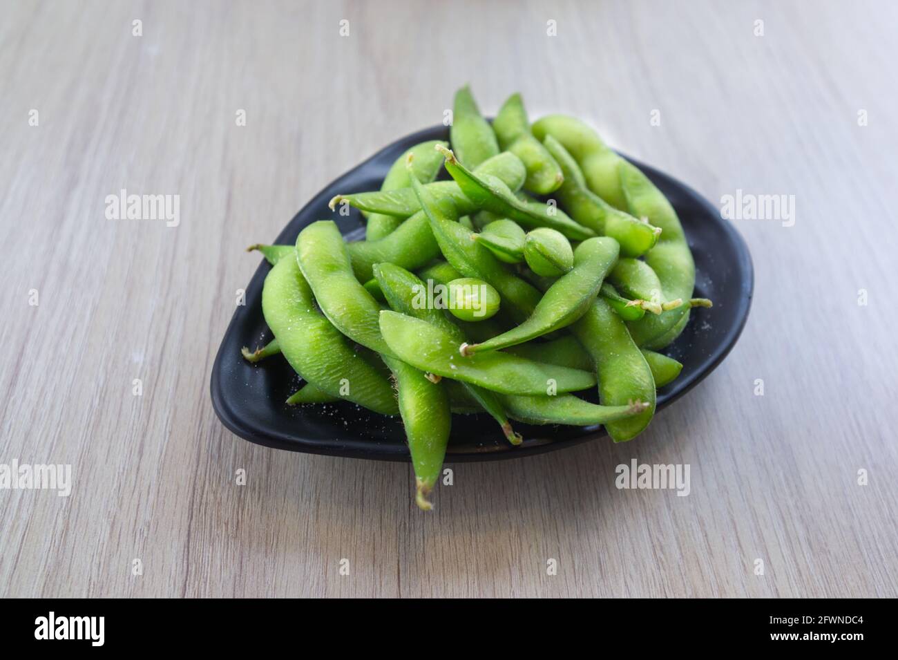 Japanese cuisine Edamame bean in bowl Stock Photo