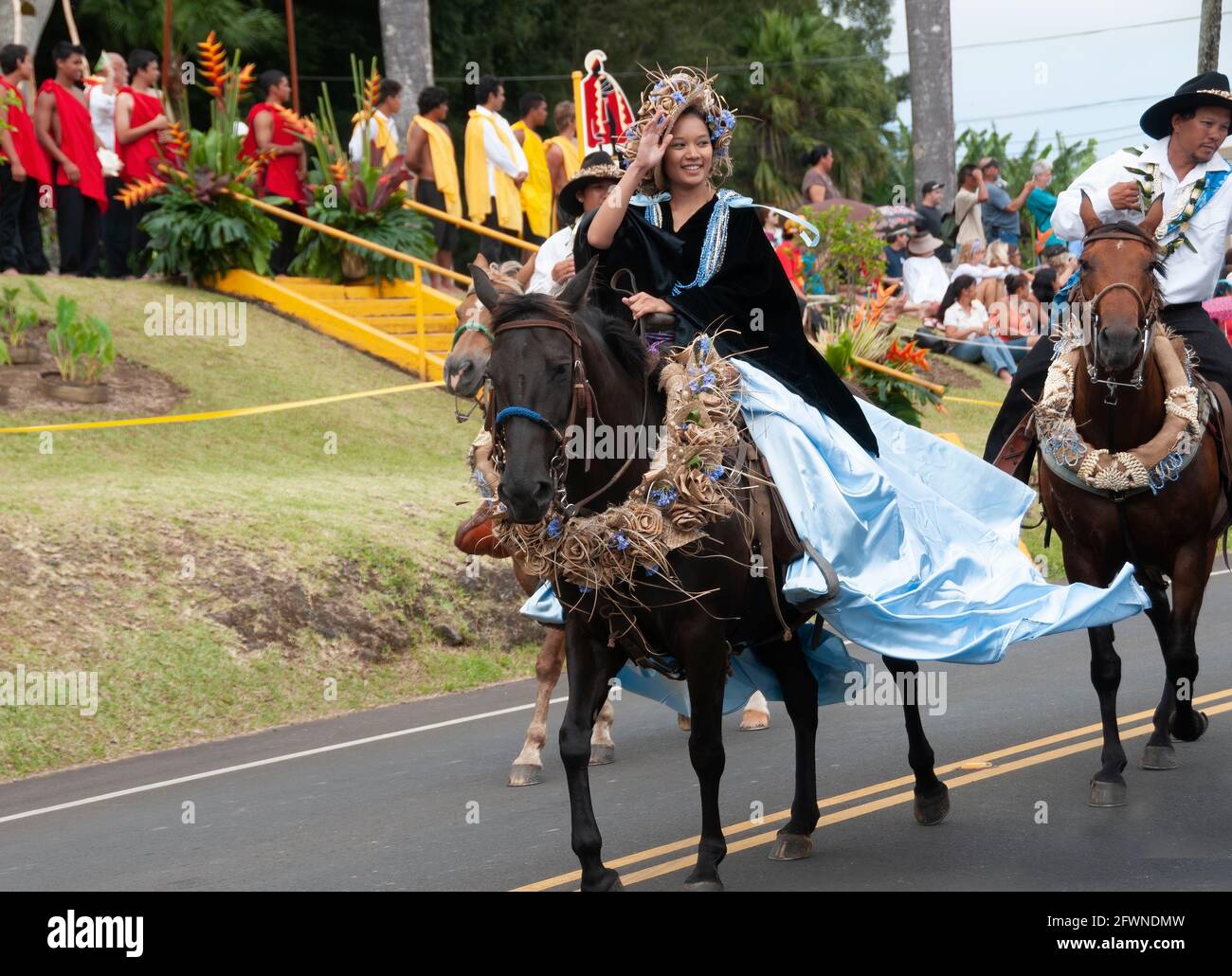 A Pa'u Princess Representing the Big Island Rides with her Paniolo Escort in the King Kamehameha Day Parade in Kapa'au, N.Kohala, Big Island, Hawaii Stock Photo