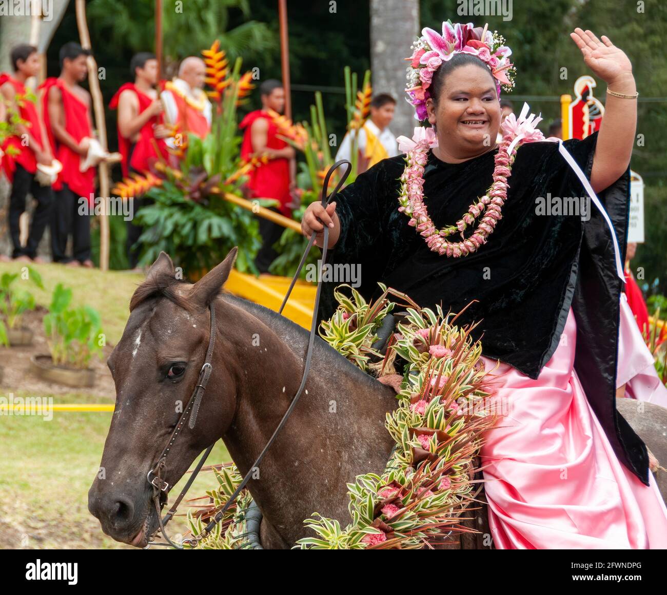 A Pa'u Princess Representing the Island of Maui Rides in the King Kamehameha Day Parade in Kapa'au, North Kohala, Big Island, Hawaii. Stock Photo