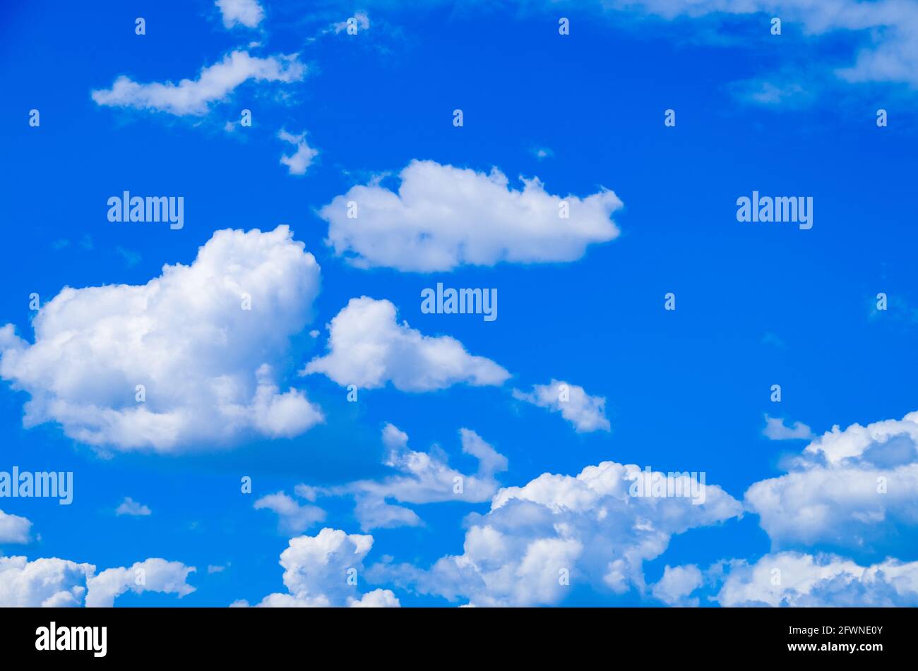 Big white clouds are floating in the blue sky Stock Photo - Alamy