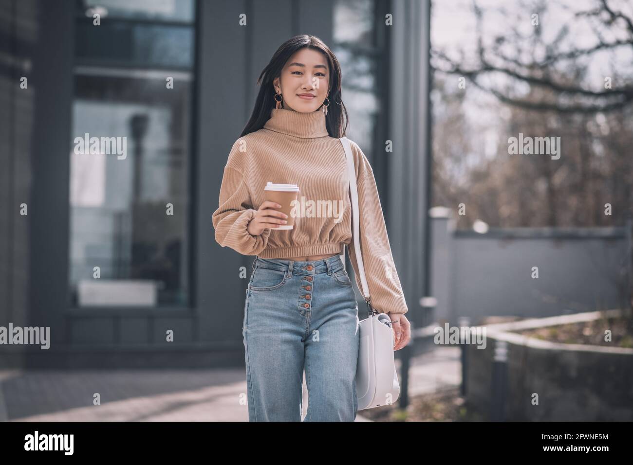 Young asian woman walking in hi-res stock photography and images - Alamy