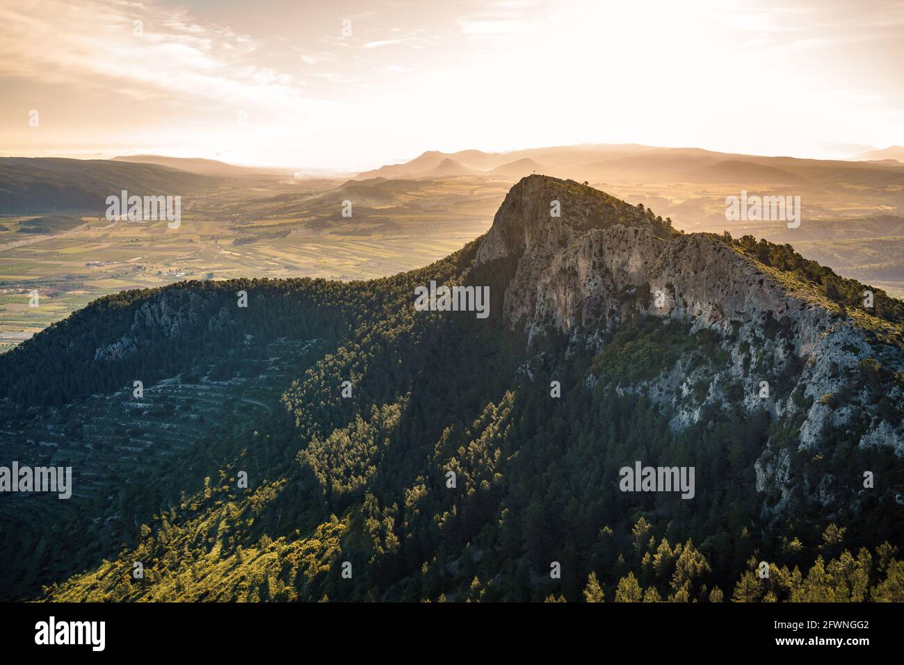 Golden hour countryside landscape. Rocky peak. Stock Photo