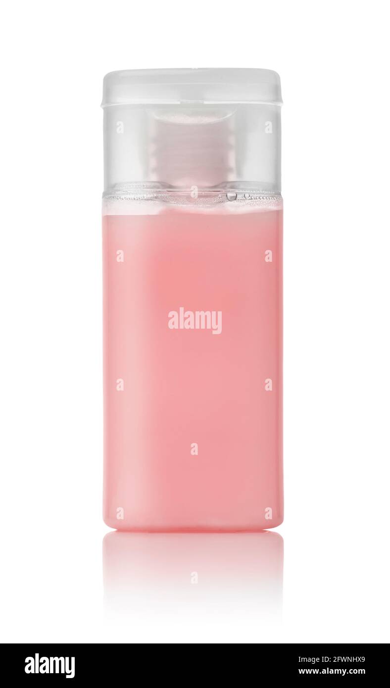 Front view of pink small plastic hotel cosmetics bottle isolated on white Stock Photo