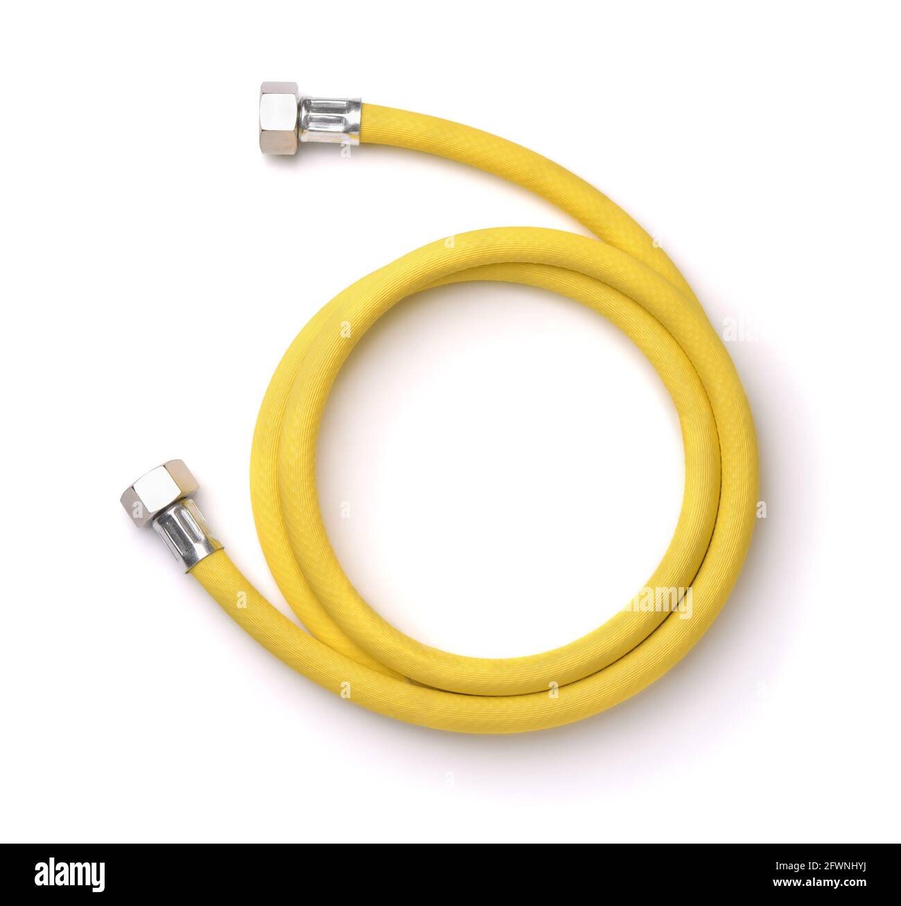 Roll of yellow reinforced propane gas hose isolated on white Stock Photo