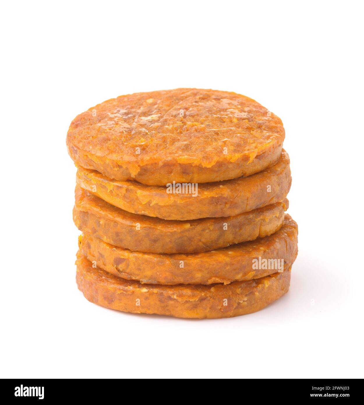 Stack of organic dried apricot and almond discs dessert isolated on white Stock Photo