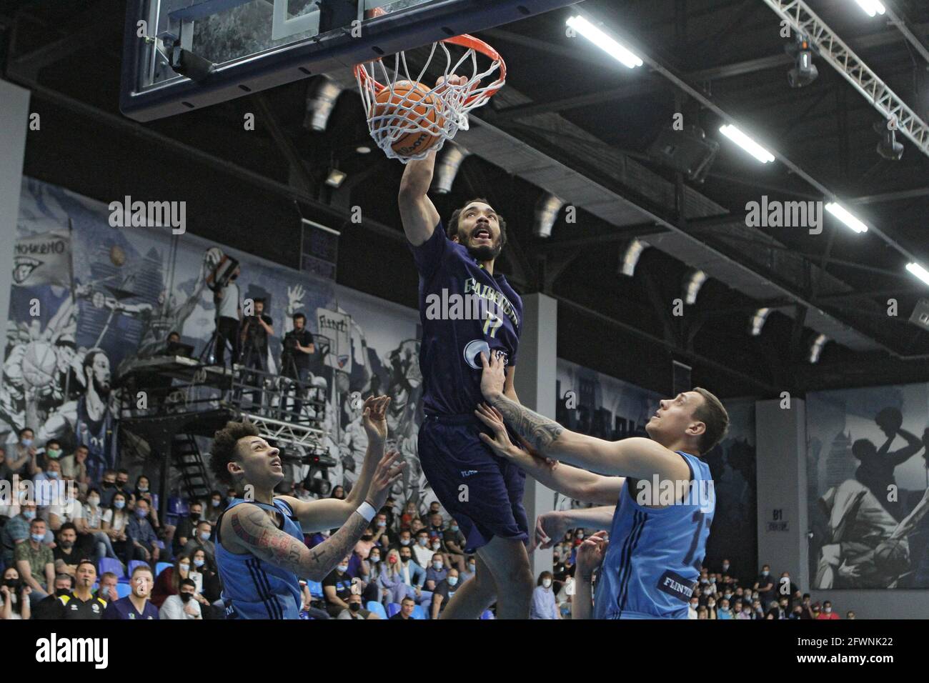 DNIPRO, UKRAINE - MAY 23, 2021 - Players of BC Dnipro (light blue kit) and  BC Budivelnyk Kyiv (dark blue kit) are seen in action during the Ukrainian  Basketball SuperLeague playoff round