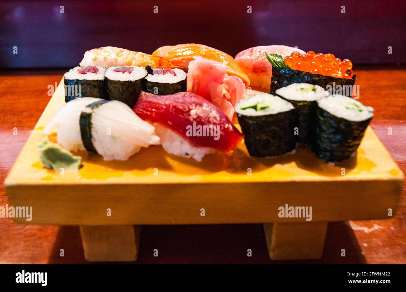 A wooden plate of sushi at a restaurant in Yudanaka, Nagano Prefecture, Japan. Stock Photo