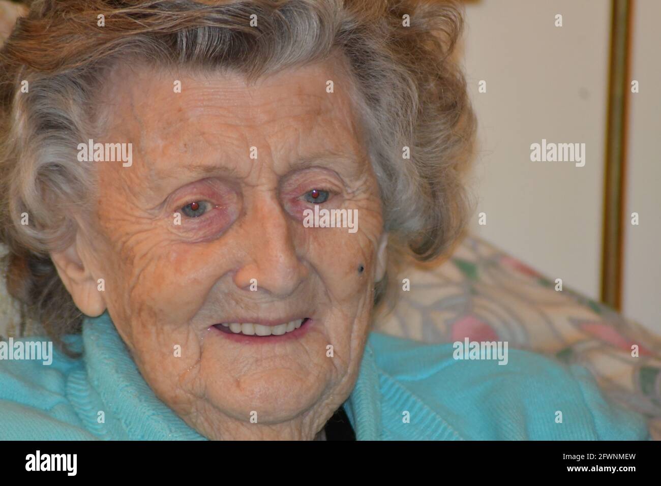 Pensive elderly woman's face close-up Stock Photo